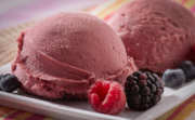 Rasberry sorbetto scoops on plate.